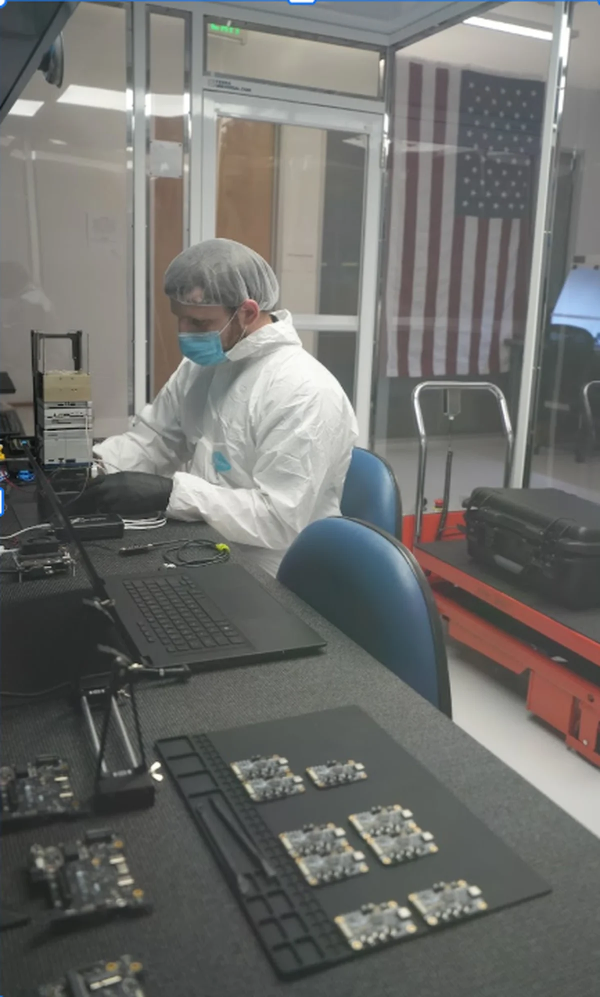Aethero engineer assembling flight boards inside the San Francisco clean room
